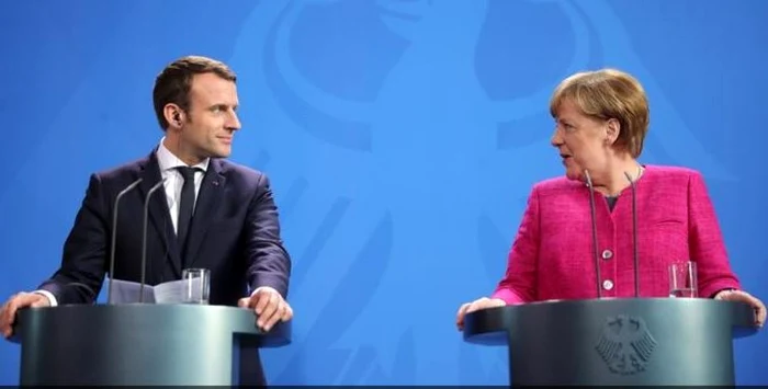 Preşedintele francez Emmanuel Macron şi cancelarul german Angela Merkel în cadrul unei conferinţe de presă FOTO Captură de ecran dw.com