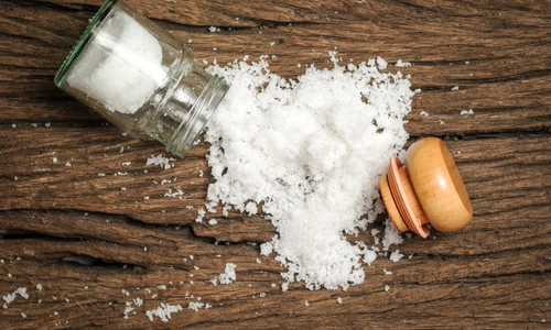 salt sprinkled on wooden table jpeg