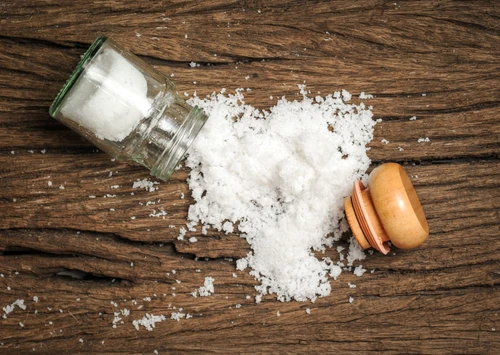 salt sprinkled on wooden table jpeg