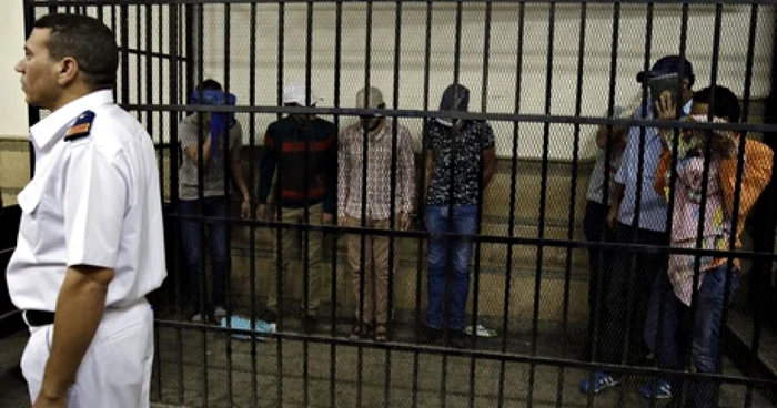 Cei opt bărbaţi au primit fiecare câte trei ani de închisoare. FOTO: AP