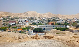 Jericho cityscape from wall ruins jpg
