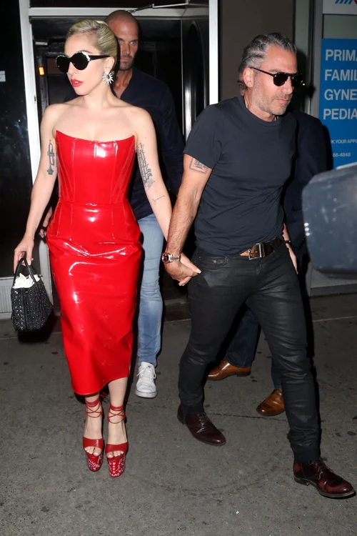 Lady Gaga greets fans on her way out in a red patent leather dress and platform heels jpeg