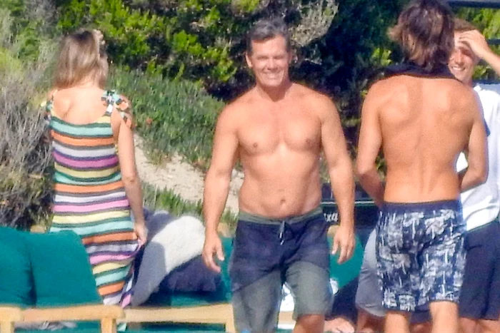 Josh Brolin and his pregnant wife at the beach jpeg