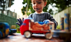 boy playing with toy trucks and watercolour jpeg