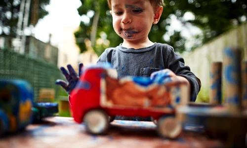 boy playing with toy trucks and watercolour jpeg