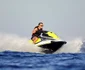 Emmanuel Macron a gonit cu un jetski. FOTO: Profimedia