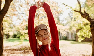 beautiful blonde girl feels happy autumn park lovely younf woman red sweater posing leaves jpg