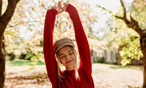 beautiful blonde girl feels happy autumn park lovely younf woman red sweater posing leaves jpg