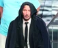 Keanu Reeves looks exhausted and in pain while filming with his pit bull for 'John Wick 3' in NYC jpeg