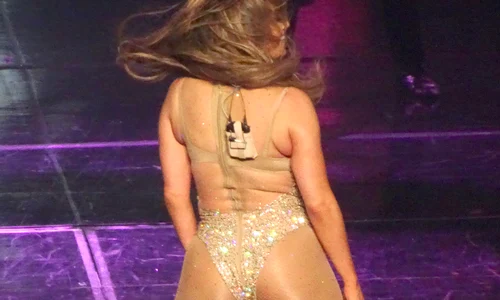Jennifer Lopez shows how flexible she is during her 1st show back from break in Las Vegas as she makes hand gestures to crowd and fans jpeg