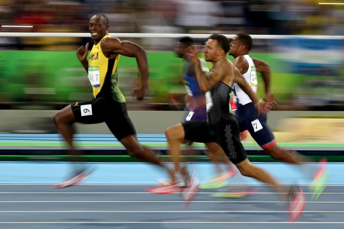 Usain Bolt în timpul probei de 100 de metri de la Rio