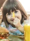 little cute girl eating fast food sandwich with fries orange juice cafe fast food concept jpg
