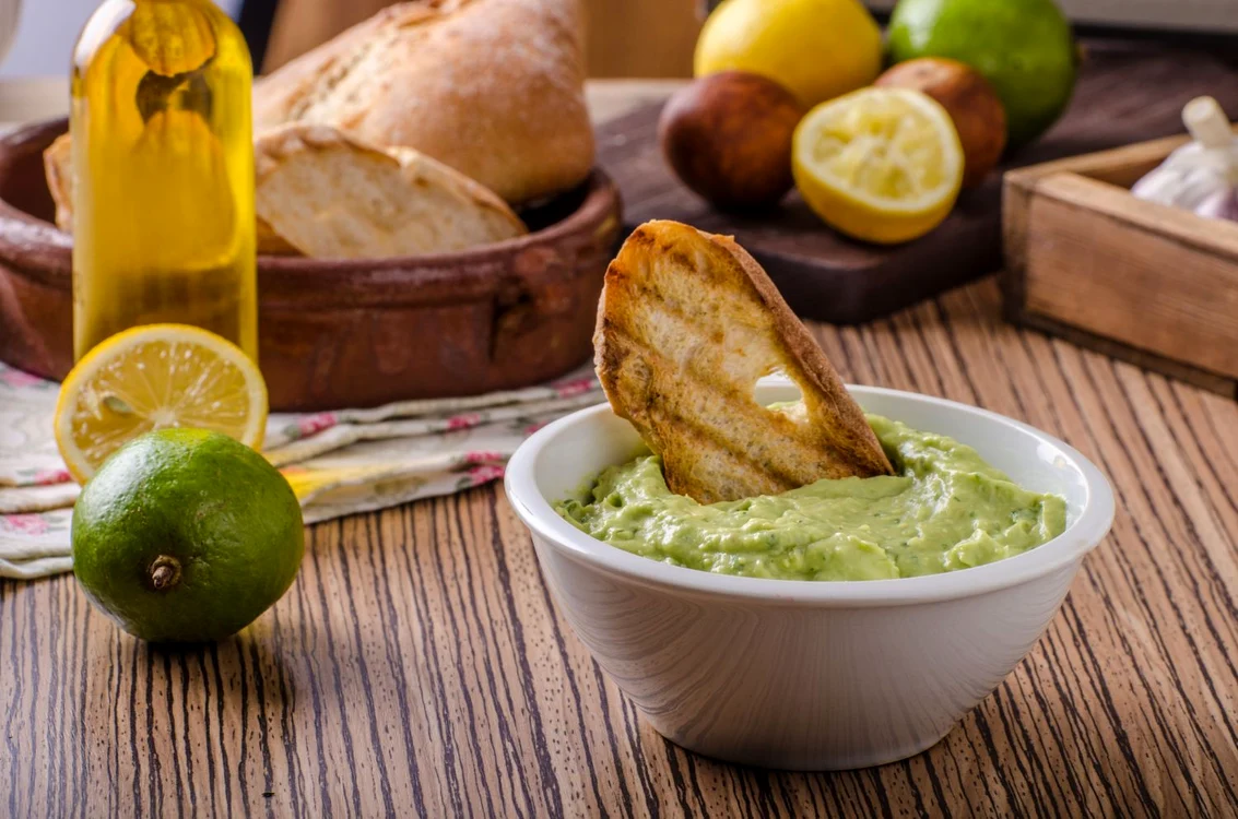 50760515   avocado basil pesto with fresh garlic toast and olive oil jpeg