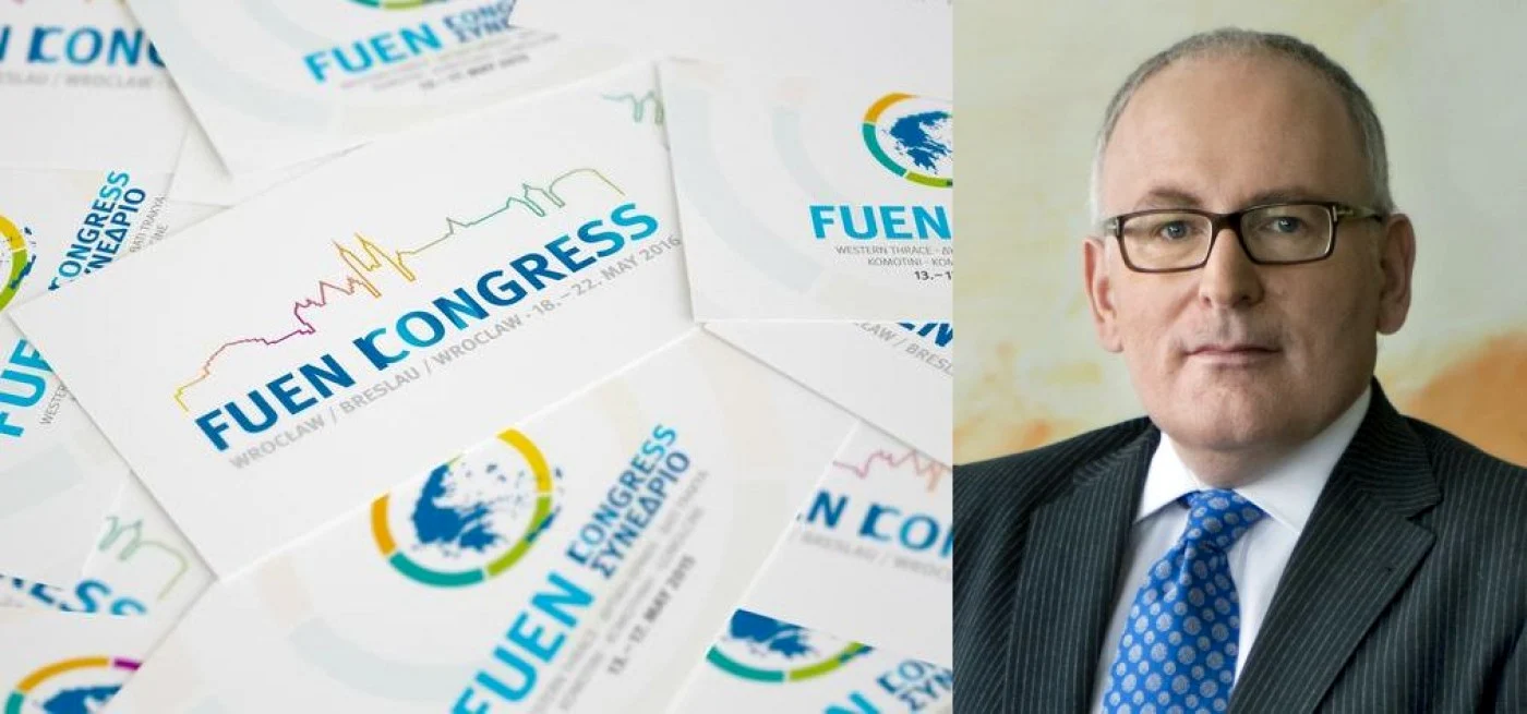 In imagine apar Frans Timmermans şi sigla FUEN (Federal Union of European Nationalities)