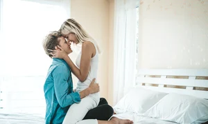 happy couple playing together bedroom jpg