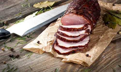 38669212   smoked ham on a chopping board  jpeg