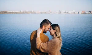 young couple park standing by river jpg