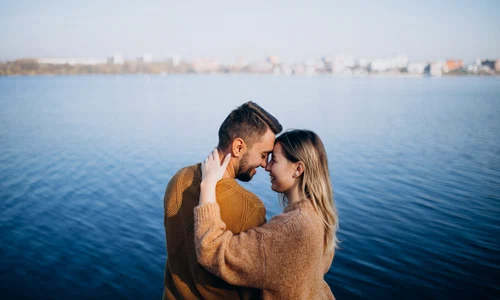 young couple park standing by river jpg