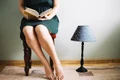 crop woman reading near lamp jpg