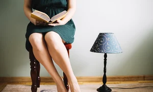 crop woman reading near lamp jpg