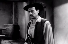 Actorul Geo Barton, în rolul personajului Lică Sămădăul, în ecranizarea din 1957 a nuvelei „Moara cu noroc”