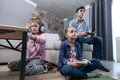 kids teenager playing video games living room jpg