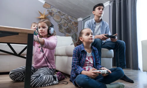 kids teenager playing video games living room jpg