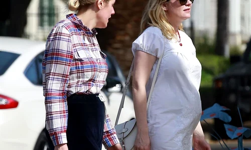 *EXCLUSIVE* Pregnant Kirsten Dunst shows off her growing baby bump in a short white dress jpeg