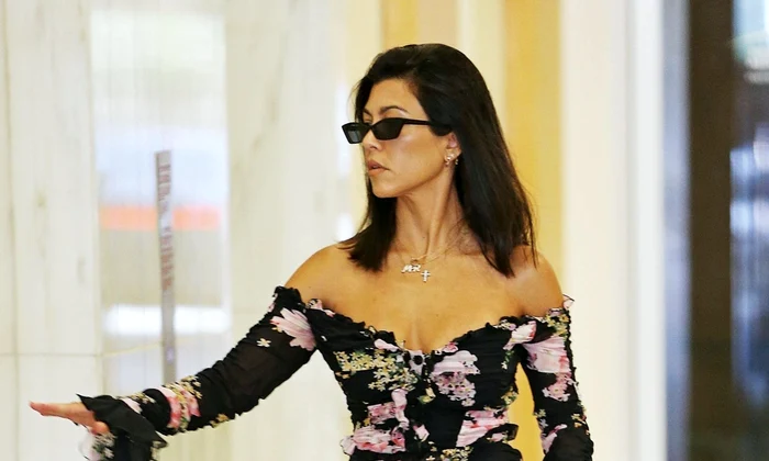Kourtney Kardashian stuns in a sexy low cut floral dress running errands jpeg