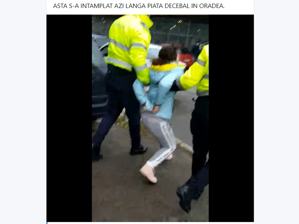 Chiar şi încătuşată, femeia s-a zbătut, refuzând să meargă la sediul Poliţiei. foto: captura