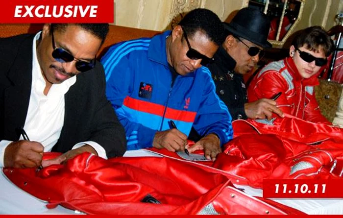 1115 jacksons signing 3 ex jpeg