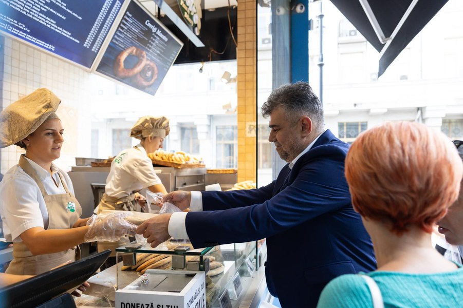Marcel Ciolacu alături de Olguța Vasilescu, la coadă la covrigi: „Umorul românilor este incredibil!”