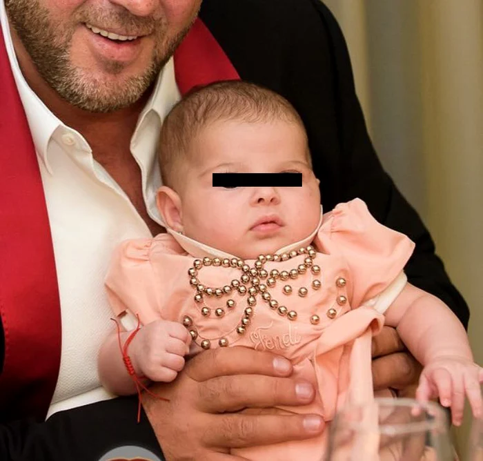 Fetiţa Mădălinei Pamfile, în braţele tatălui ei