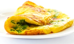 13134807 scrambled eggs with fresh herbs on a white background jpeg