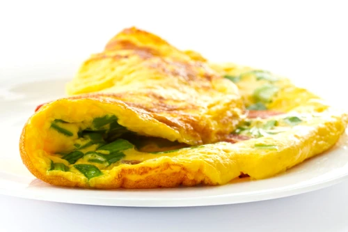 13134807 scrambled eggs with fresh herbs on a white background jpeg
