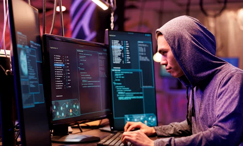 asian criminal hood hacking server stealing data while committing online crime young hacker running illegal malicious software code computer screen cracking password jpg