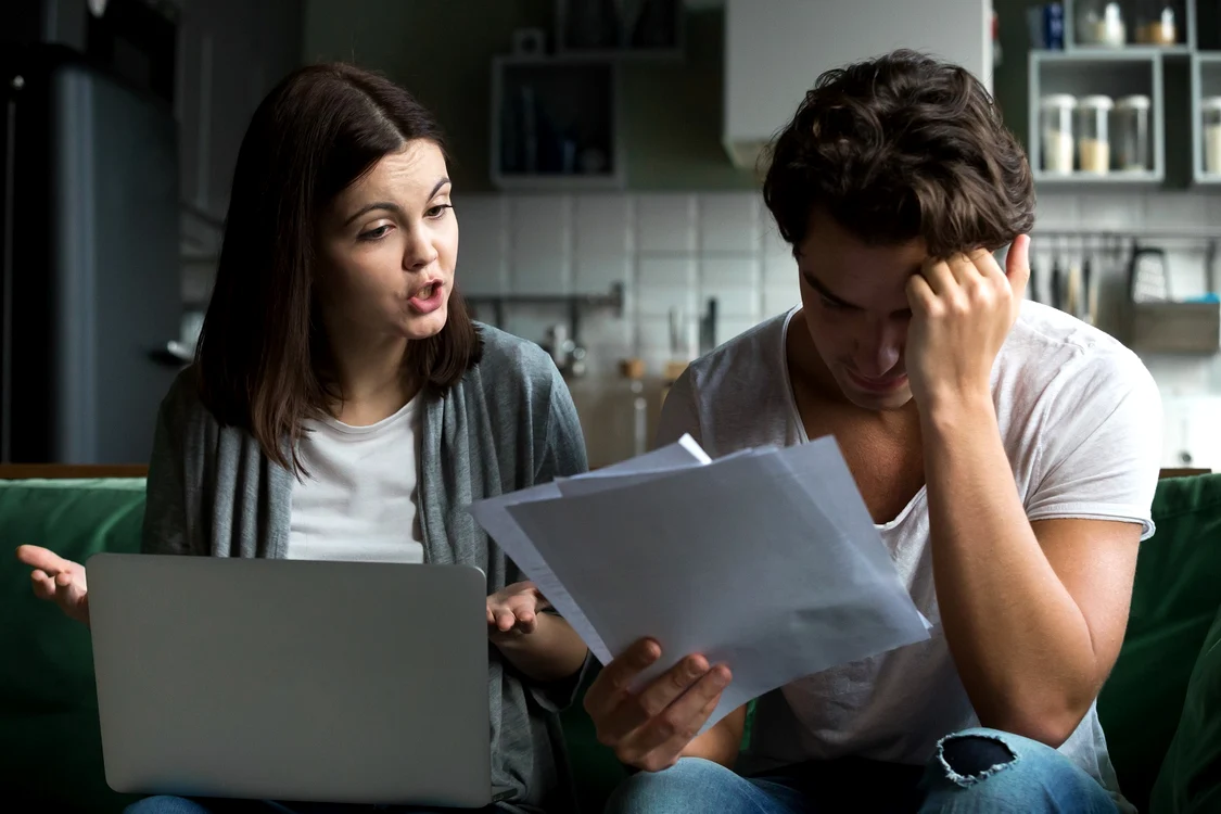 angry wife scolding blaming upset husband unpaid bills jpg