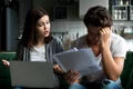 angry wife scolding blaming upset husband unpaid bills jpg