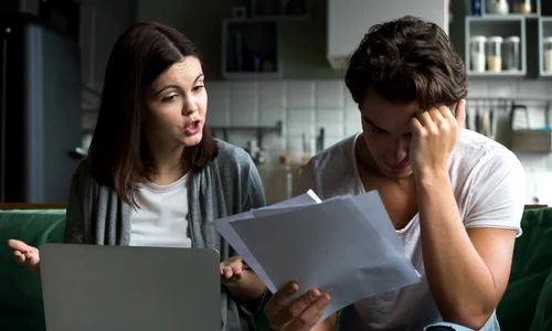 angry wife scolding blaming upset husband unpaid bills jpg