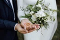 wedding bands hands bride groom with beautiful wedding bouquet made greenery white flowers jpg