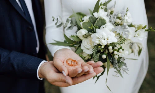 wedding bands hands bride groom with beautiful wedding bouquet made greenery white flowers jpg
