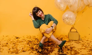 happy female model sitting floor covered with confetti laughing enchanting caucasian girl posing with balloons her birthday jpg