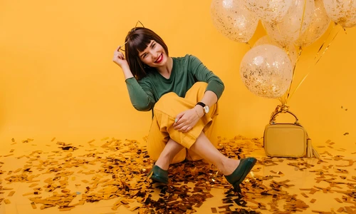 happy female model sitting floor covered with confetti laughing enchanting caucasian girl posing with balloons her birthday jpg