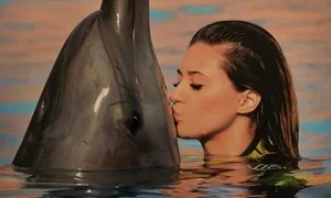 Bruneta s a bălăcit cu un delfin jpeg