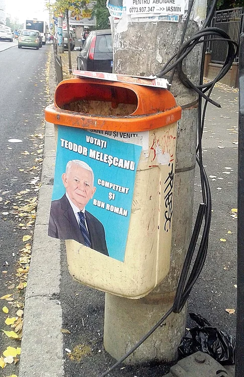 Teodor Meleşcanu zâmbeşte de pe coşul de gunoi. Cu mustaţă şi fără!