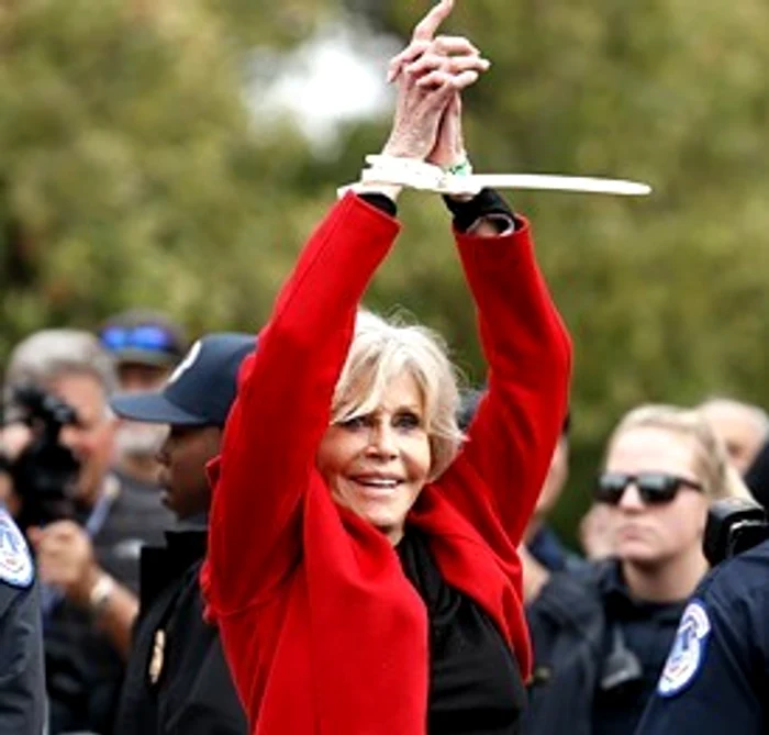 jane fonda accepts award while being arrested jpg jpeg