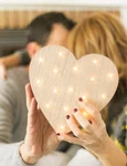 adult couple kissing covering with heart jpg