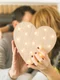 adult couple kissing covering with heart jpg