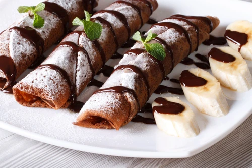chocolate crepes with fruit and sauce close up Horizontal jpeg