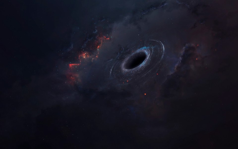 O enigmatică gaură neagră supermasivă, învăluită de praf cosmic, descoperită de astronomii israelieni